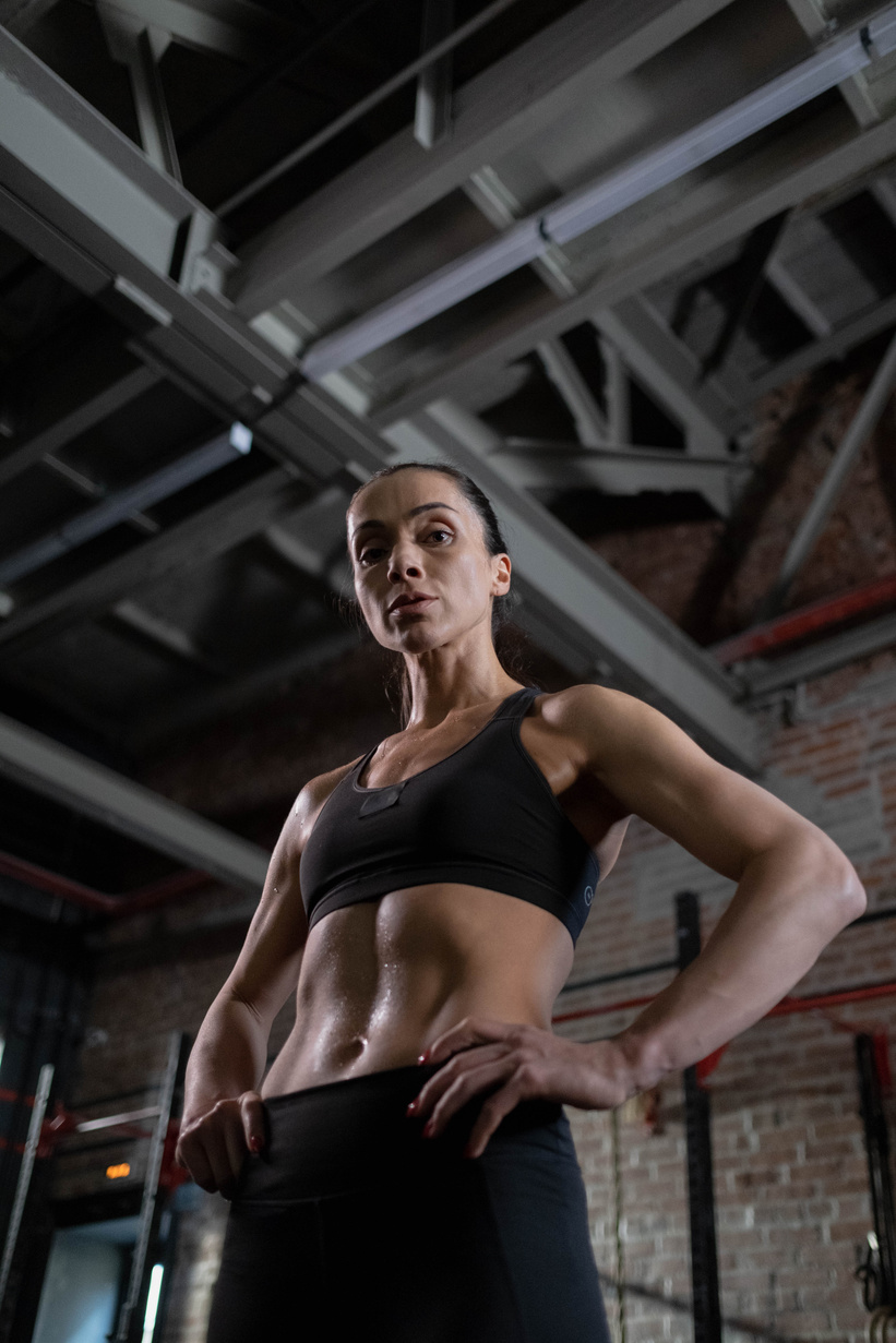 Low-Angle Shot of a Woman in Black Sports Bra